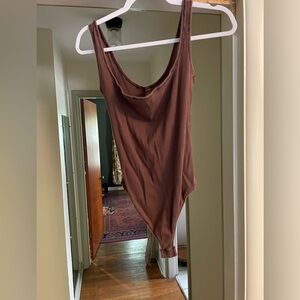 SKIMS cotton ribbed brown thong bodysuit.